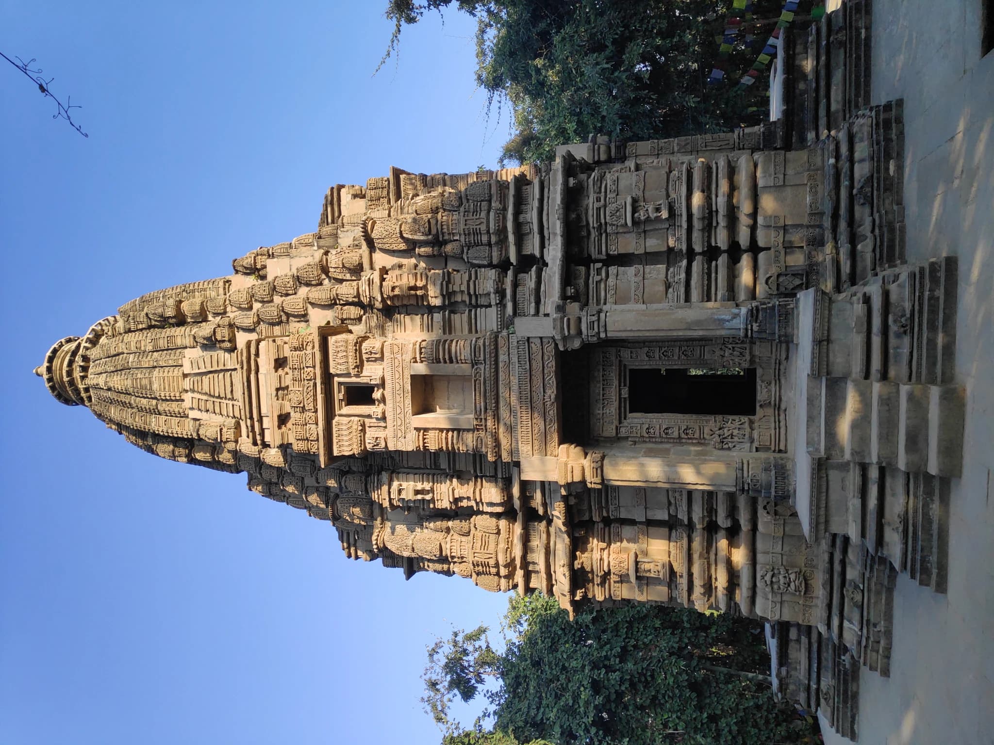 Intricately carved medieval stone bas-reliefs and architectural friezes at the sanctum of Kakre Bihar